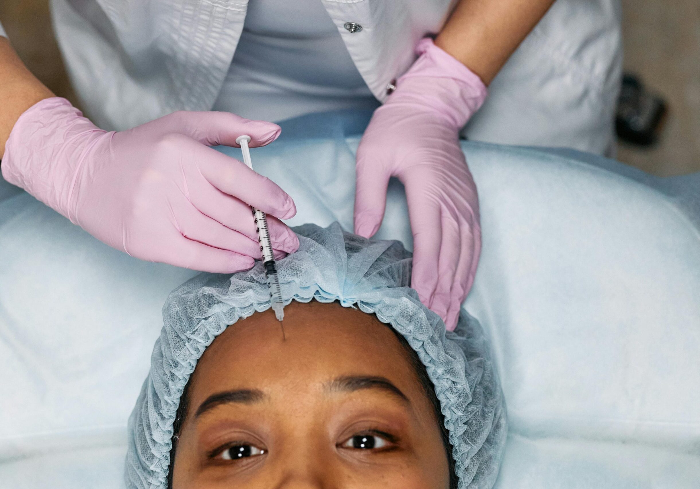Image of a woman receiving Botox injections.